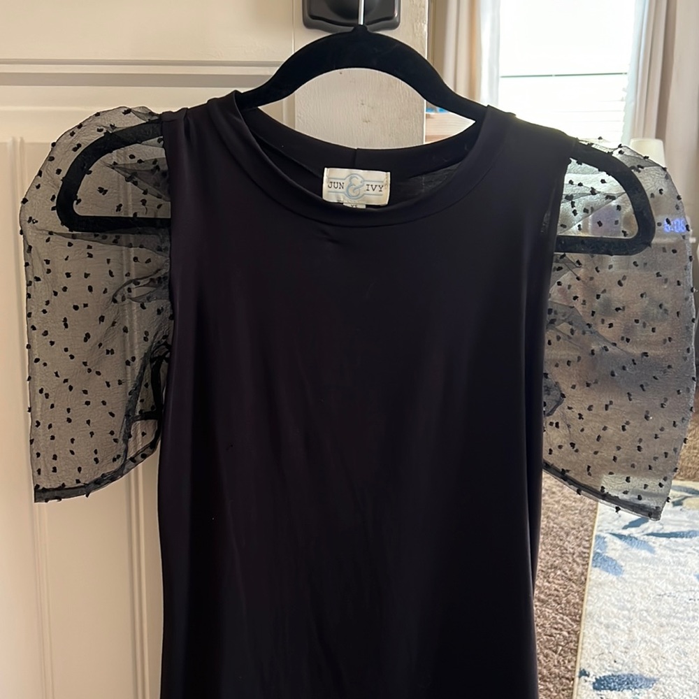 Top with mesh dotted sleeves, Size small but material is soft and stretchy